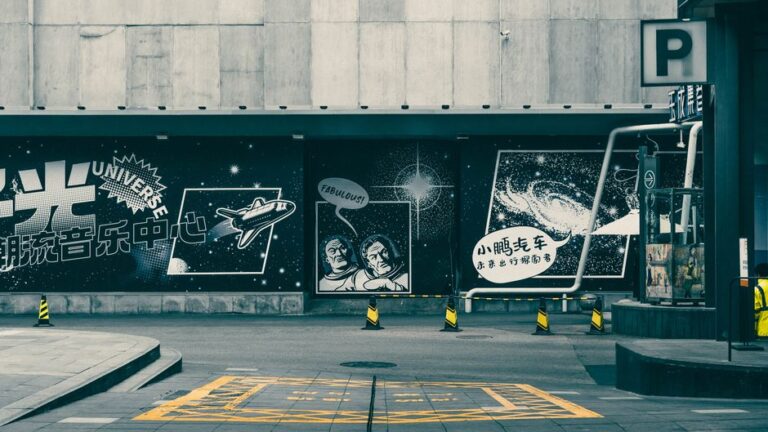 Engaging space-themed street art on a building in Chengdu, showcasing a unique artistic urban style.